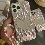 قاب موبایل آیفون گل ریز قلب آیینه ای موج دار رزگلد ( بدون بند )