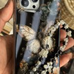 قاب موبایل آیفون پروانه ترنسپرنت مشکی پولکی طلایی